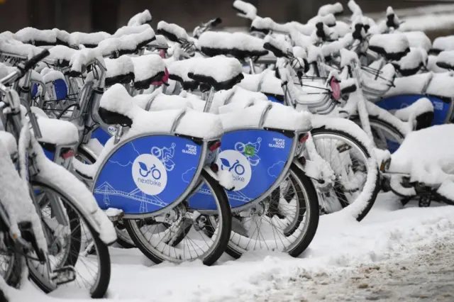 Bicycles are covered in snow on February 28, in Glasgow, Scotland