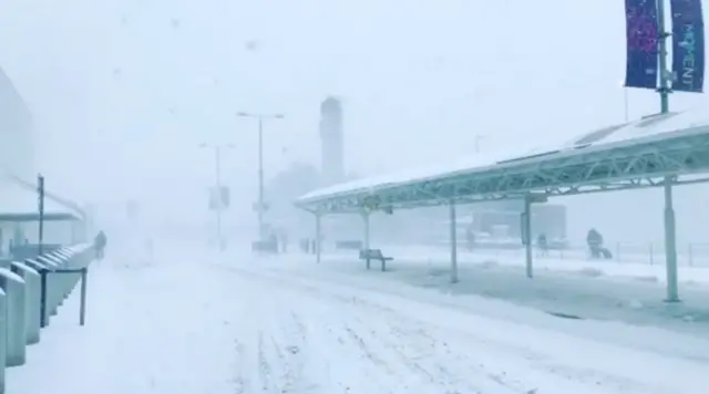 Glasgow airport covered in white