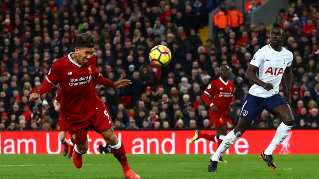 Firmino heads the ball