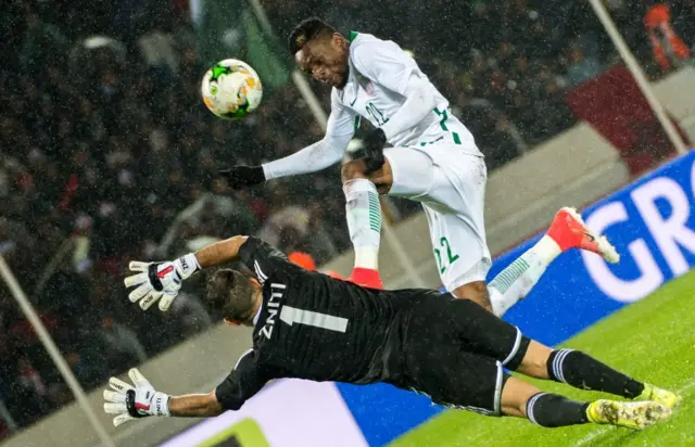 Morocco's goalkeeper Anas Zniti (L) defends as Nigeria"s Okechukwu Ojo attempts a shot on goal during the African Nations Championship (CHAN) football final between Morocco and Nigeria at the Mohammed V. Casablanca Stadium on February 4, 2018 in Casablanca