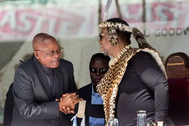 President Jacob Zuma (L) greets Zulu King Goodwill Zwelithini at the Moses Mabhida Football stadium to celebrate South Africa's Heritage Day in Durban on September 24, 2016.