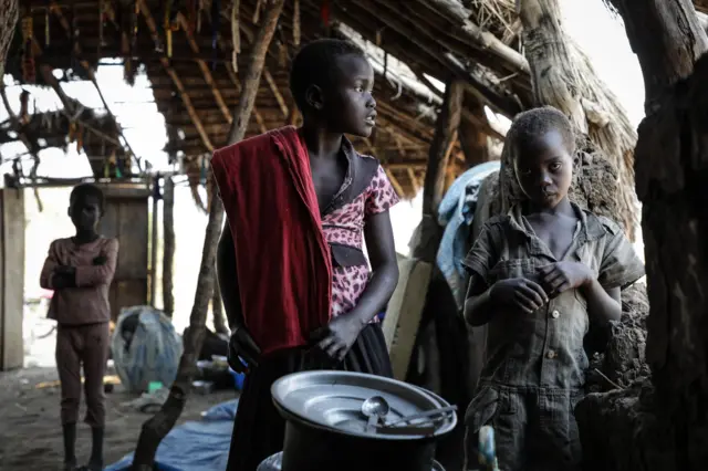 South Sudanese children fleeing from recent fighting in Lasu in South Sudan stand in a church after crossing the border into the Democratic Republic of Congo, near Aba, on December 23, 2017