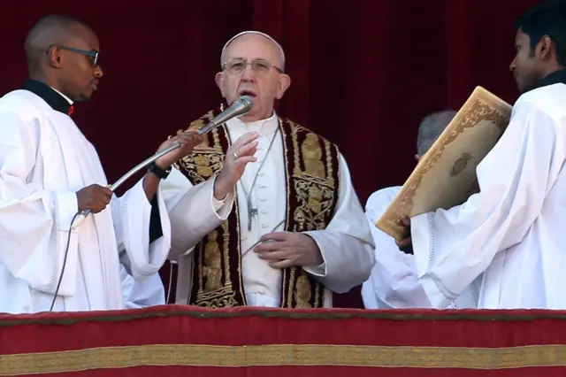 Pope Francis delivers his Christmas Urbi Et Orbi blessing from the central balcony of St. Peter's Basilica on December 25, 2017 in Vatican City, Vatican