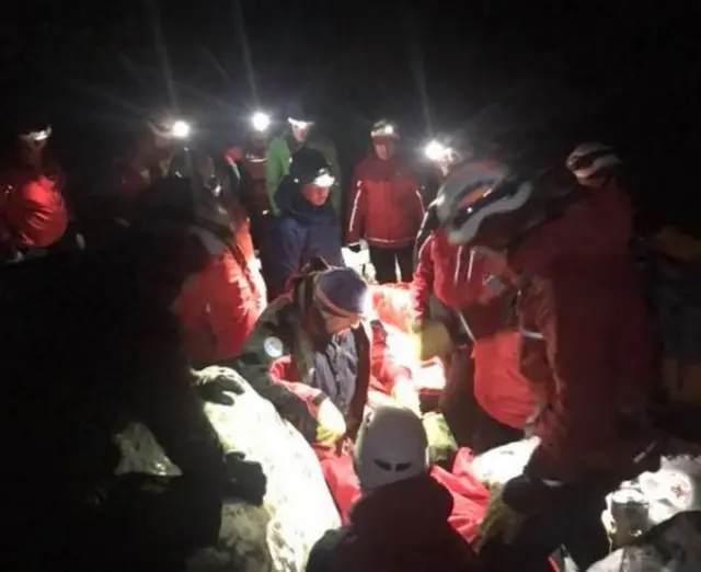 Team members practice an extraction in icy conditions