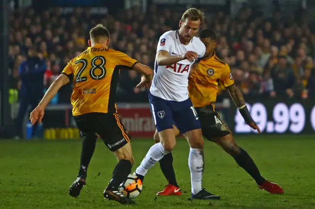 Newport players tackle Harry Kane