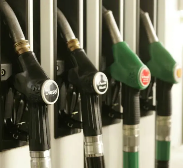 A close shot of fuel pumps at a petrol station