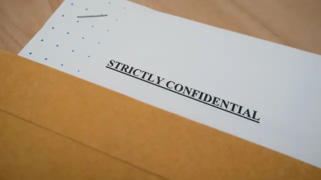 A document that reads: Strictly confidential