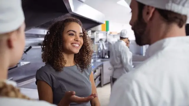 Caterers in a kitchen