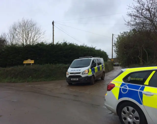 Police leaving the farm near Manaccan