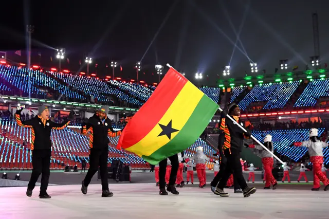 Flag bearer Akwasi Frimpong of Ghana  and his teammates