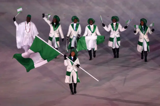 Flag bearer Ngozi Onwumere of Nigeria enters the stadium with teammates during the Opening Ceremony of the PyeongChang 2018 Winter Olympic Games