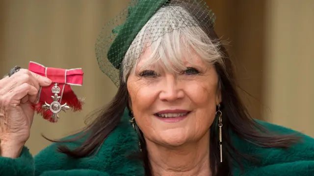 Sandie Shaw, collecting her MBE at Buckingham Palace