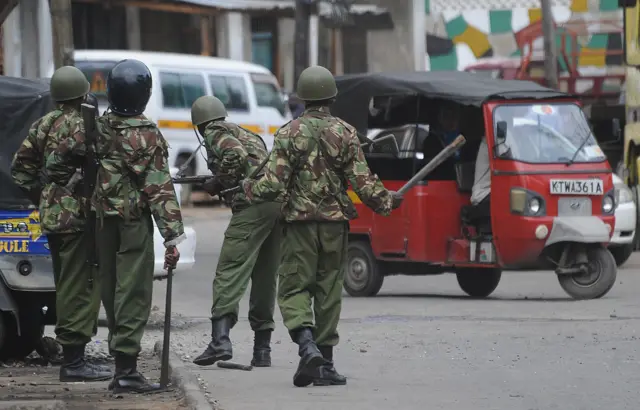 Kenyan policemen patrol the streets of Mombasa