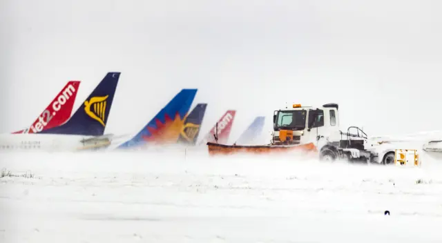 Airplane tails visible through snow