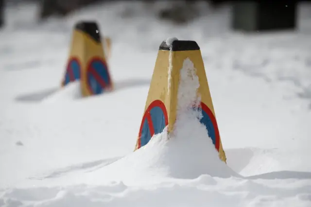 Traffic cones show the extent of the snow in Baillieston, Glasgow