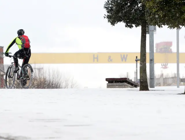 Cyclist in the snow in Belfast