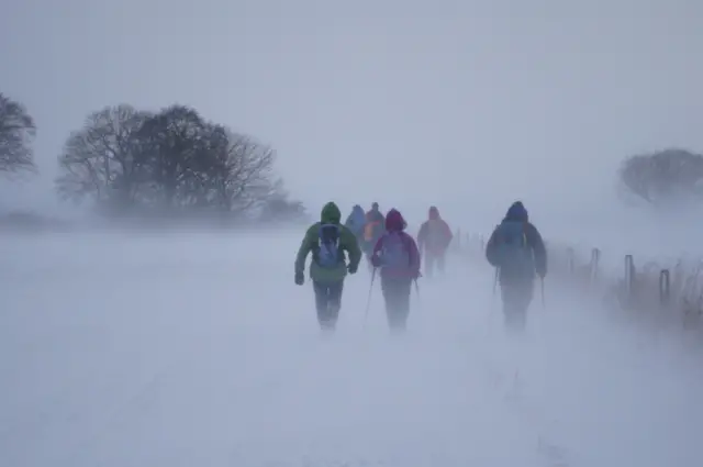 Walkers in snow