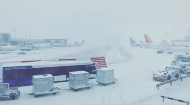 Heavy snow is seen at Glasgow Airport in Glasgow