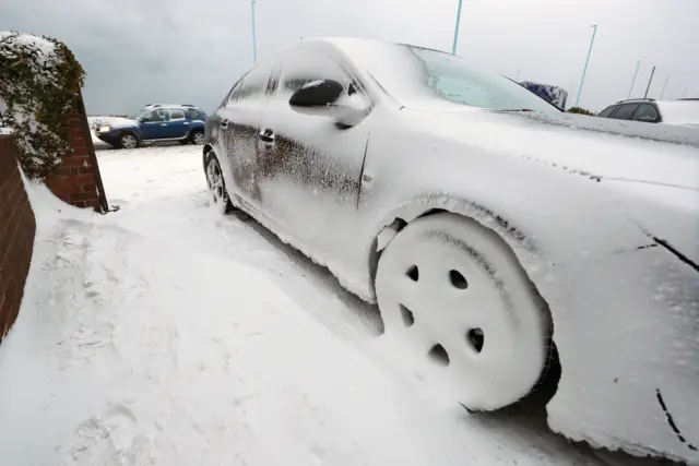 A snow-covered car parked up in Whitley Bay