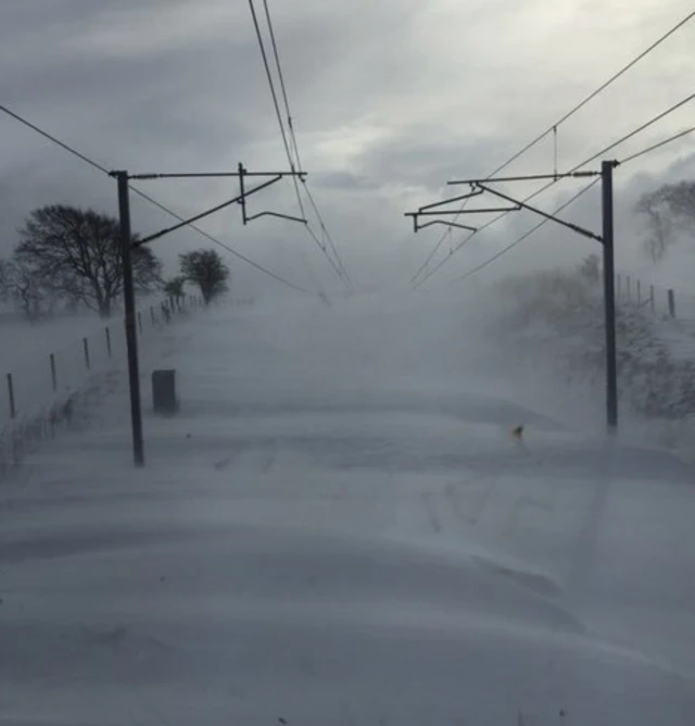 A snow-covered railway line in Scotland