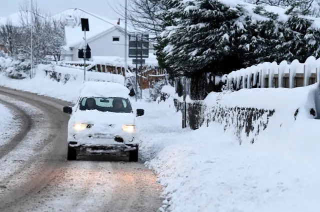 A 4x4 makes its way along the A813 on March 1, 2018 in Alexandria, Scotland.