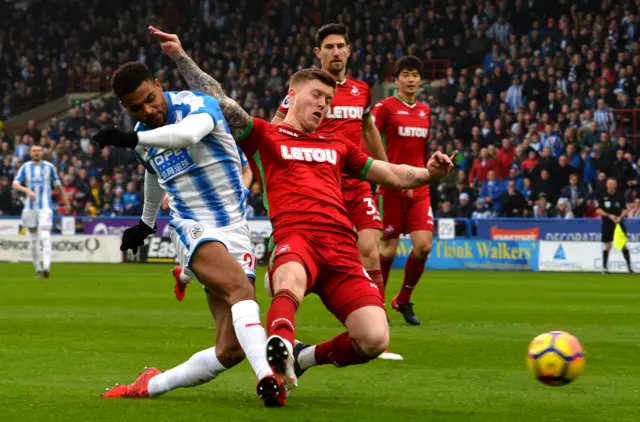 Steve Mounie and Alfie Mawson