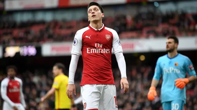 Mesut Ozil of Arsenal reacts