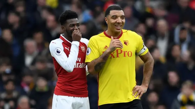 Troy Deeney shares a joke with Ainsley Maitland-Niles