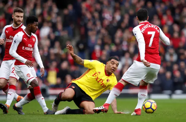 Arsenal's Henrikh Mkhitaryan comes away with the ball