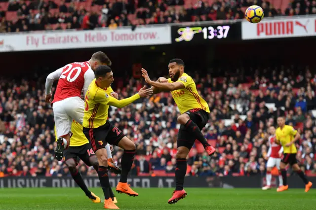 Shkodran Mustafi heads at goal