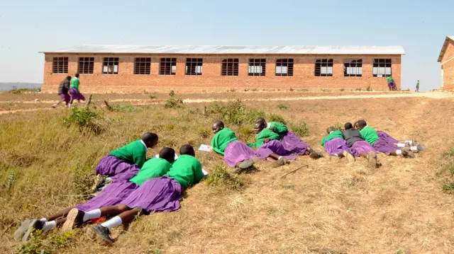 Girls taking a break at Mtitu Secondary School where they live and studies during school terms at Kilolo district, approximately 500 kilometres south-west of Tanzanian capital, Dar-es-Salaam, on September 01, 2008