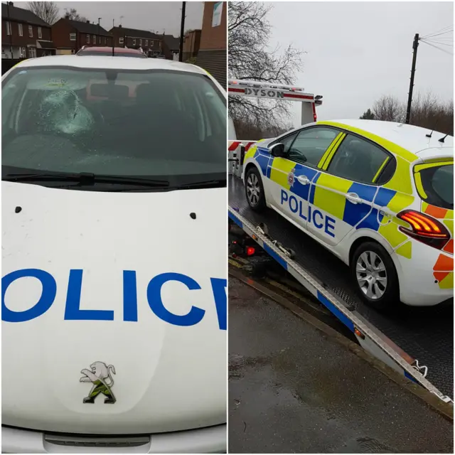 Police car with smashed windscreen