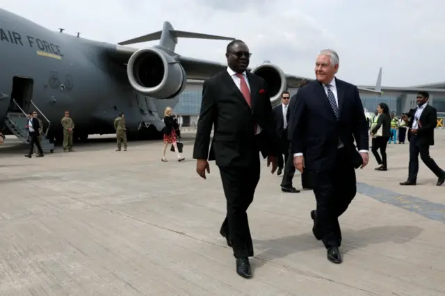 Nigeria"s Ministry of Foreign Affairs, the Permanent Secretary Olukunle Bamgbose walks with U.S. Secretary of State Rex Tillerson as he arrives in Abuja, Nigeria, March 12, 2018.