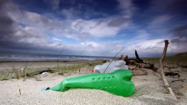 plastic bottles on beach