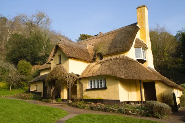 A thatched cottage in the village of Selworthy, Somerset, in the Exmoor National Park