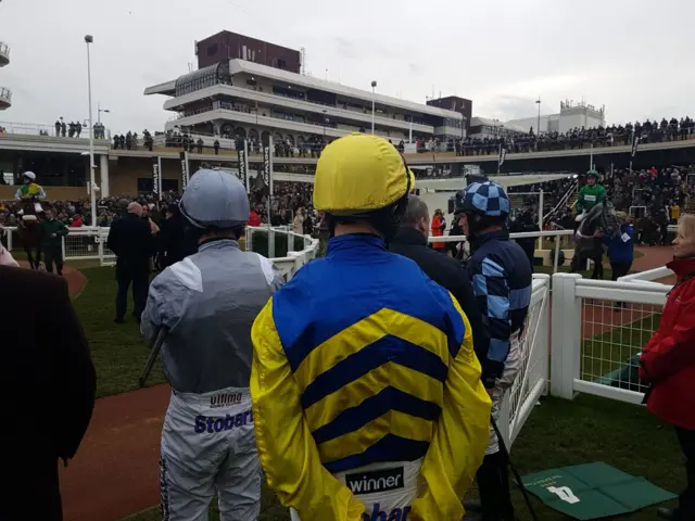 three jockeys await their rides