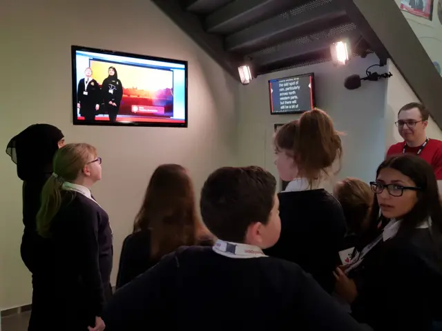 Pupils from Earls High School, in Halesowen, try presenting the weather