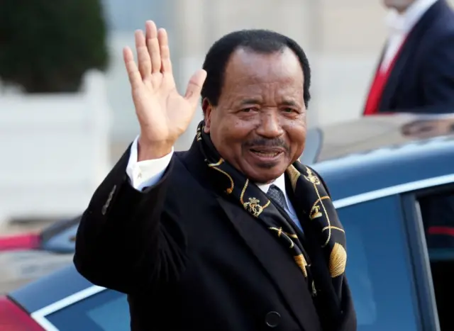 Cameroon president Paul Biya waves as he leaves the Elysee Palace in Paris following a meeting with his French counterpart in 2013