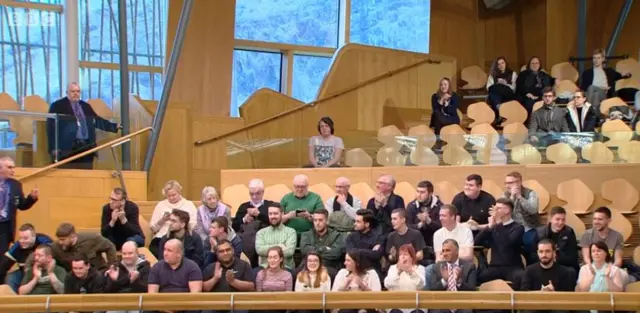 Public gallery applauding passage