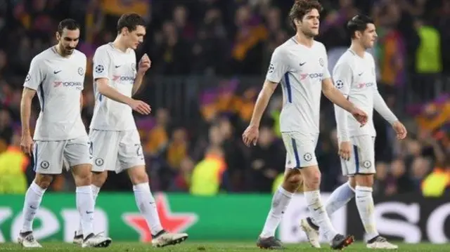 Dejected Chelsea players walk off the pitch after defeat in the Nou Camp against Barcelona