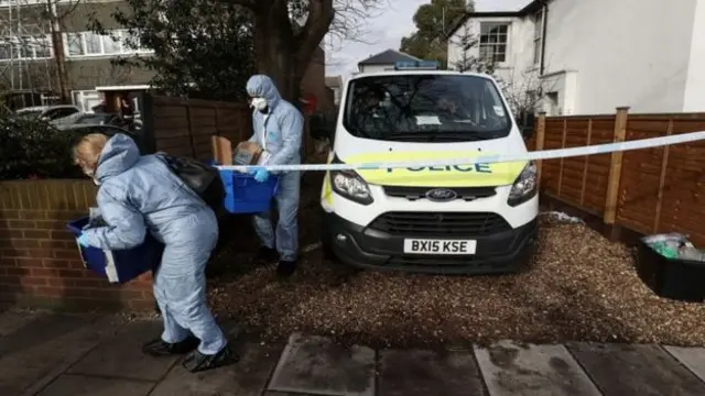 Forensic officers outside South Road, Twickenham