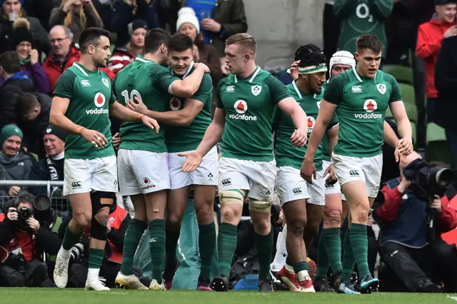 Ireland rugby players celebrate a try against Scotland