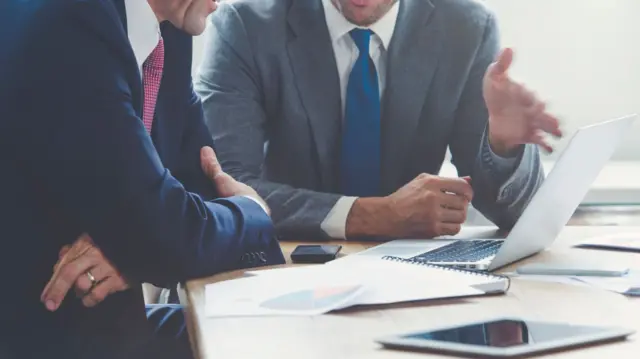 Two men in a meeting