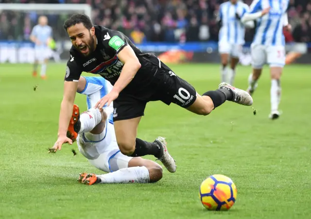 Andros Townsend of Crystal Palace is tackled by Mathias Jorgensen