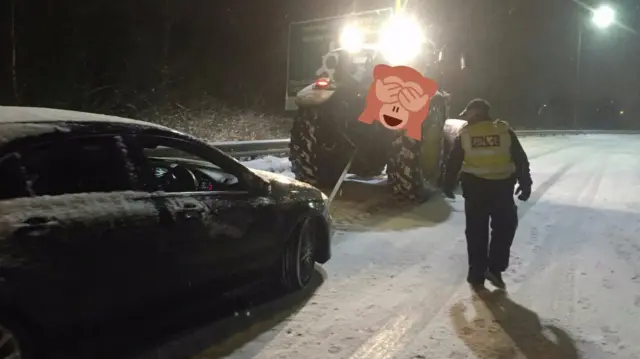 Tractor tows vehicle