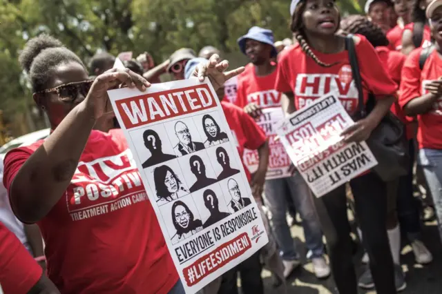 Hundreds of South African members of the non-governmental organisation Treatment Action Campaign (TAC) protest outside the Life Esidimeni arbitration public hearing on January 22, 2018 in Johannesburg, South Africa. At least 143 mentally ill patients died after South African authorities moved them in 2016 from hospital to unlicensed health facilities that were compared to 'concentration camps'.