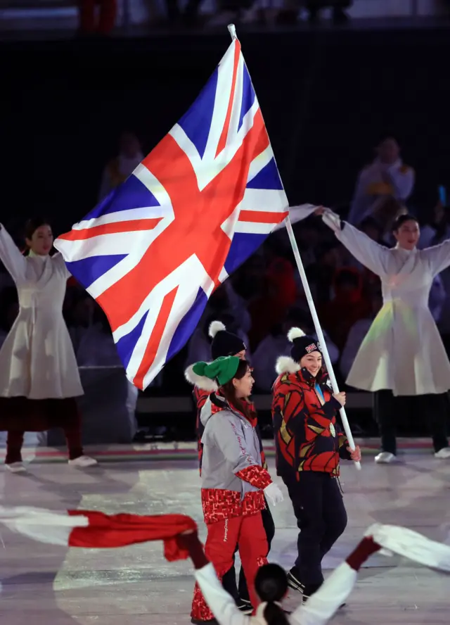 Meena Fitzpatrick carrying the GB flag