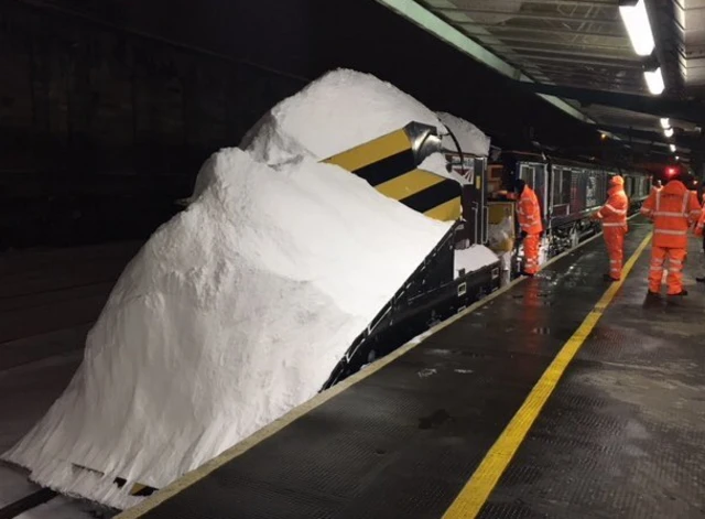 Snowlough train covered in snow