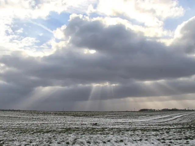 Light shines through the clouds