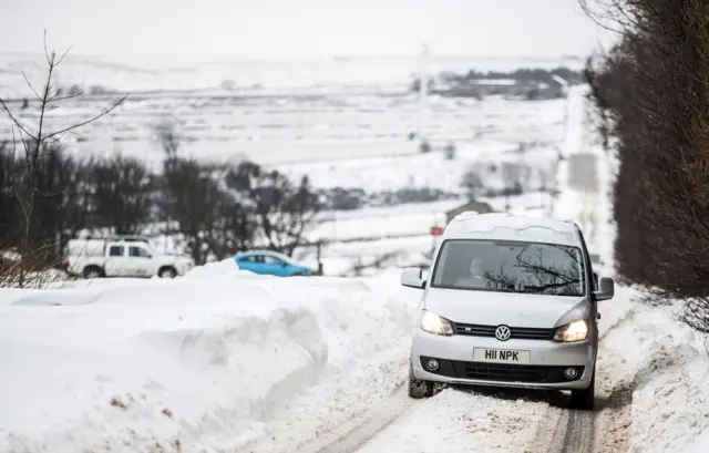 Van on snowy road